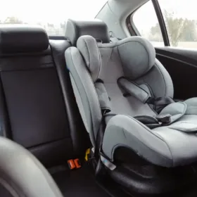 Child car seat securely installed in the backseat of a vehicle.